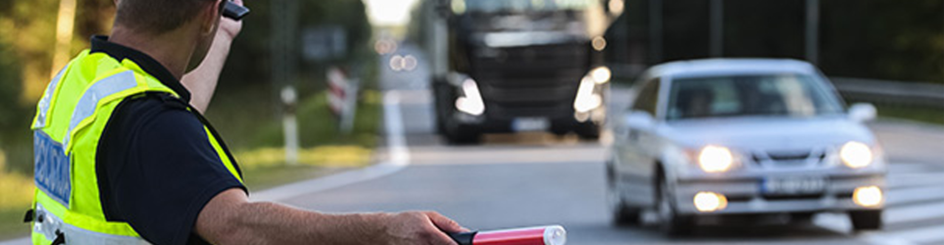 Traffic marshal managing vehicles on site
